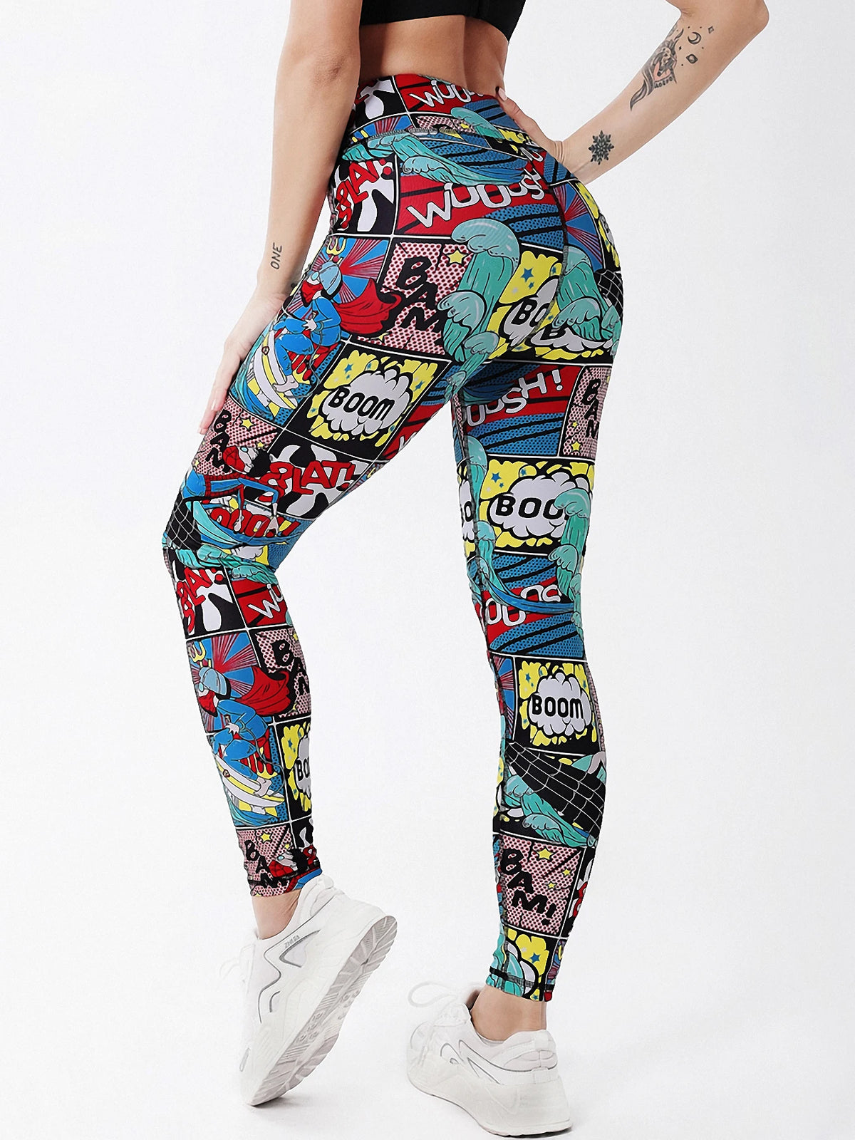 Person wearing colorful comic book pattern leggings on a white background