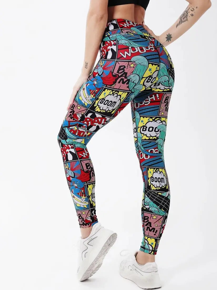 A model wearing high-waisted leggings with a colorful comic book pop-art print, shown from the waist down against a plain white background.